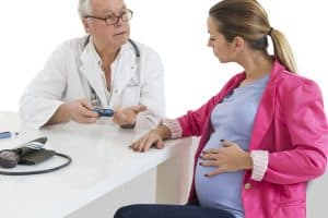 A gestational diabetes in third trimester consult. Pregnant Woman at doctor office