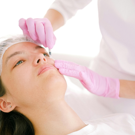 woman receives botox injection for chronic migraine