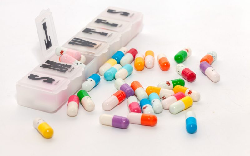 102146604 - colorful pill in the box on white background