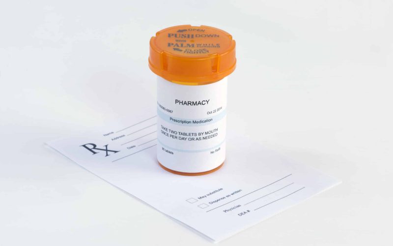 34767427 - orange prescription bottle on blank prescription.