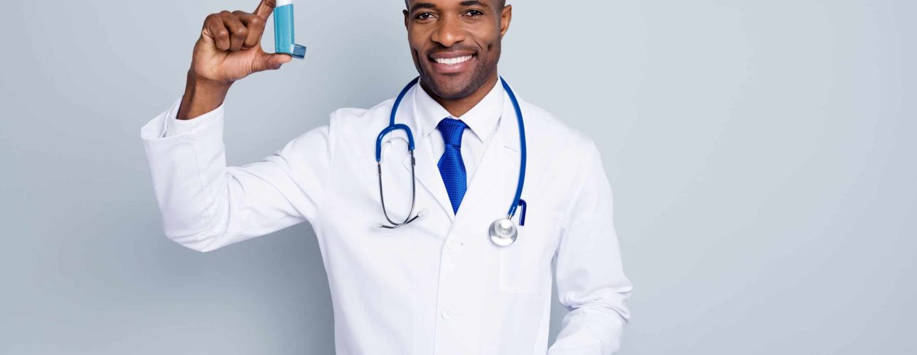 Photo of family doc dark skin guy hold inhaler asthma attack advising, medical prescription against self-treatment concept wear stethoscope lab coat isolated grey color background