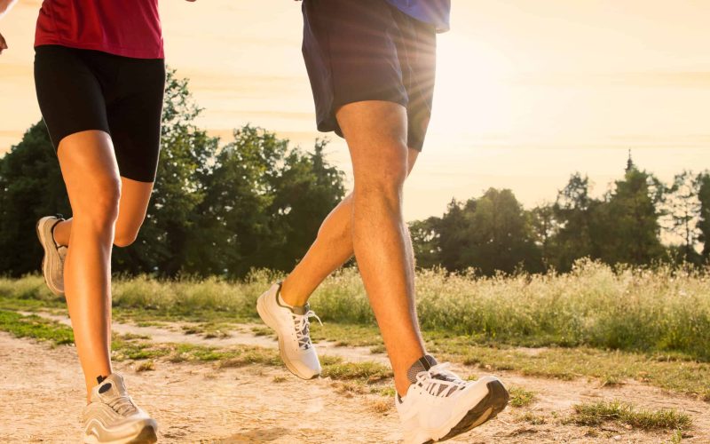 22583738 - legs view of a couple jogging outdoor in the park