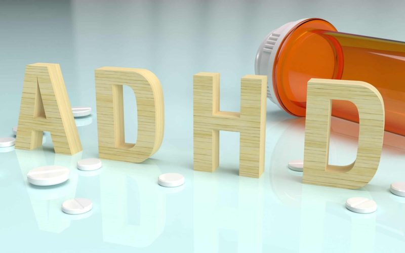 ADHD wood text on glossy plate for medical content 3d rendering.