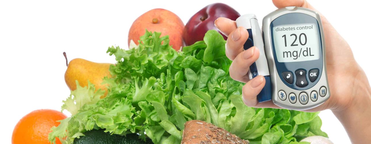 Diabetes diabetic concept. Measuring glucose level blood test on organic food fruits and vegetables background