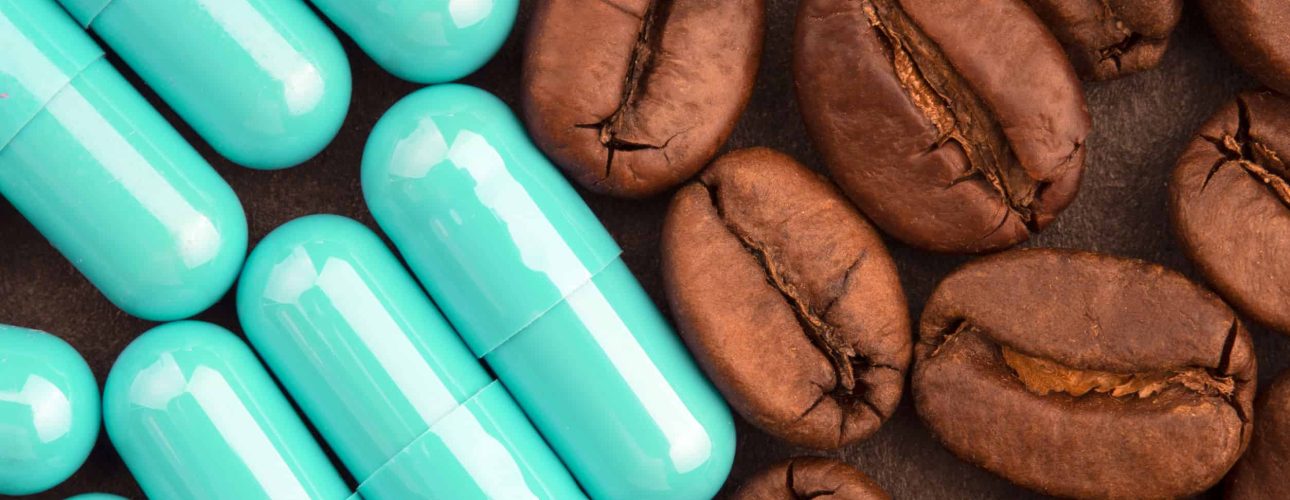 coffee beans and pills, closeup, top view