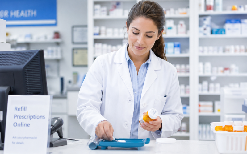 An image of a pharmacist filling a prescription during the prescription filling process