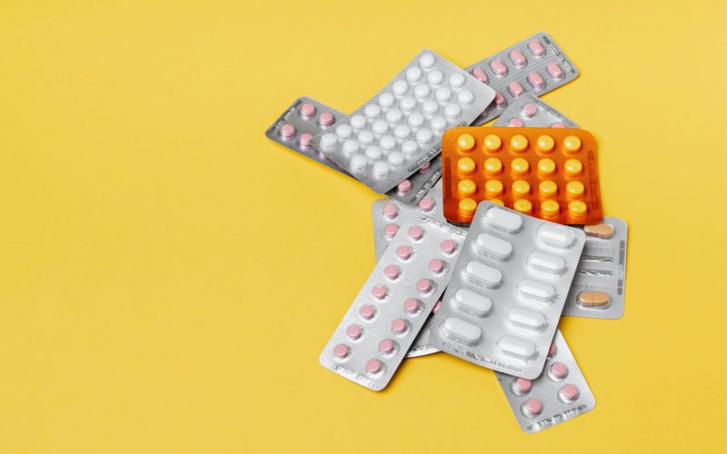 a pile of pill packages