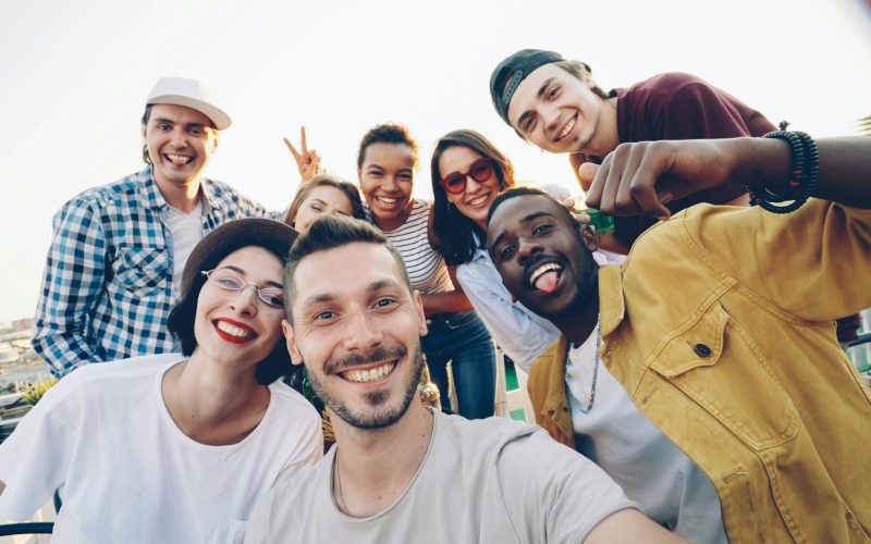 A group of people are smiling, showing the effectiveness of Spravato